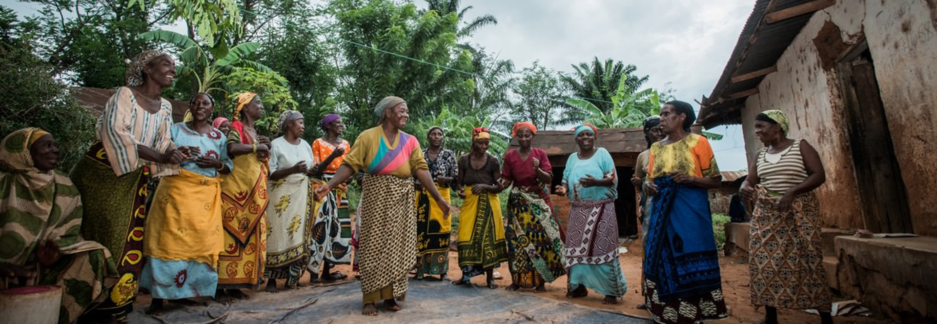 Women from the Warumba Wakombozi Womens Group perform a dance