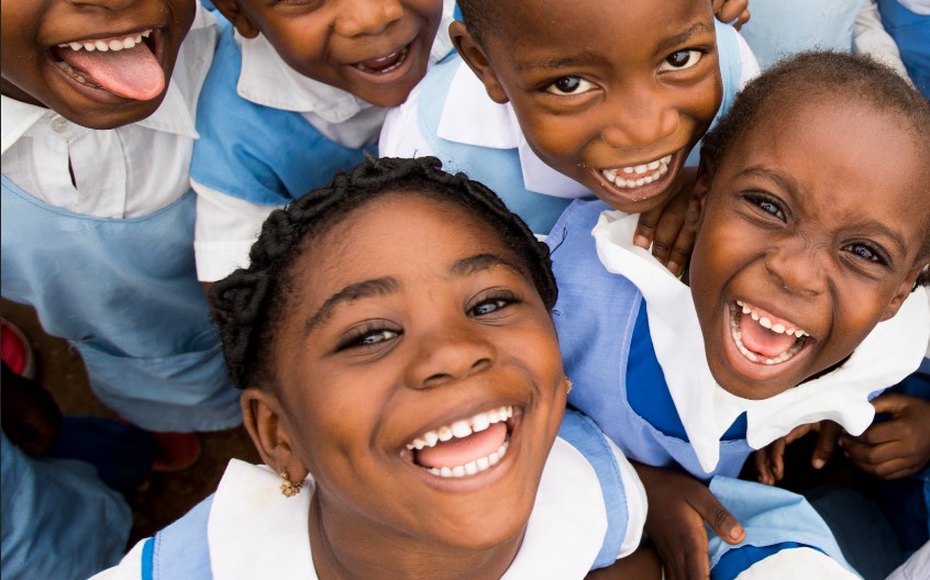 a group of children smiling